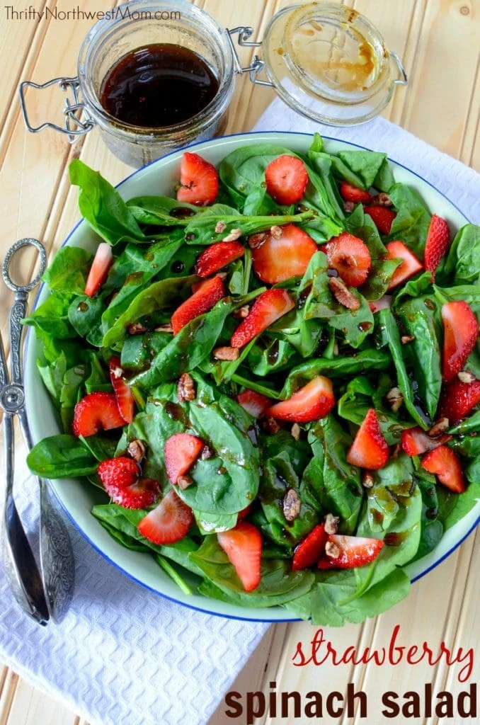 Strawberry Spinach salad is an easy & frugal summertime salad, perfect to bring to a picnic or 4th of July as an easy side dish. 