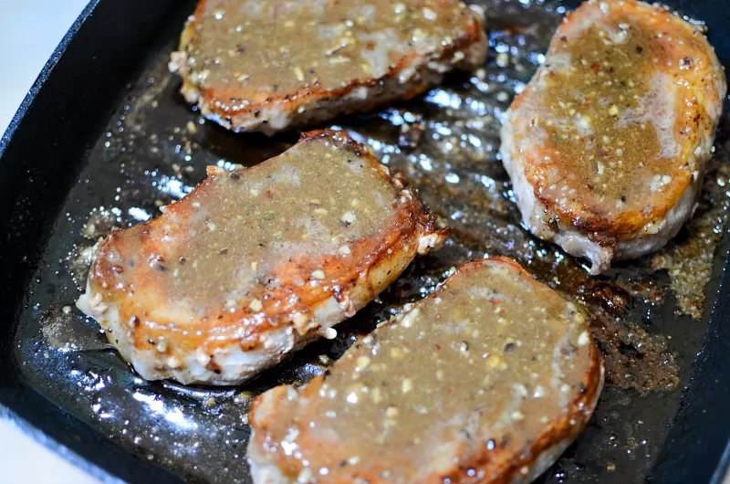 Honey Spice Glazed Porkchops cooking on stove