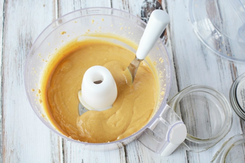 Creamy peanut butter in the food processor for homemade peanut butter