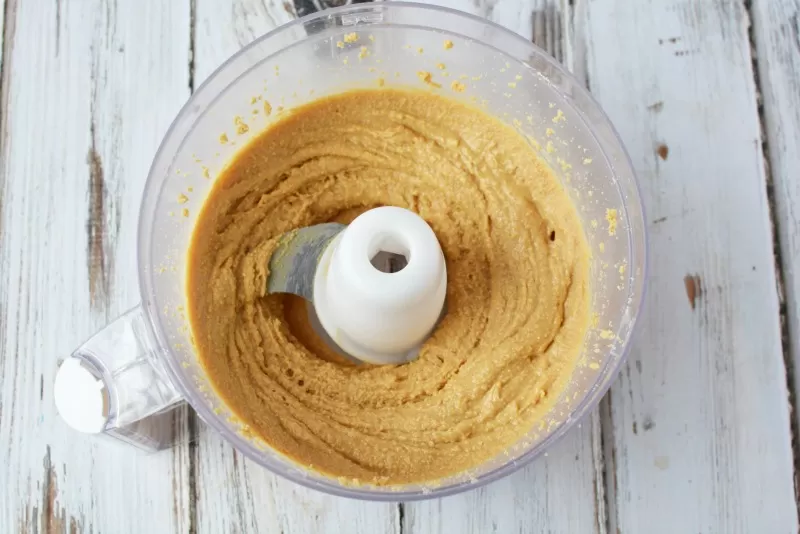 Mixing peanuts in food processor to make homemade peanut butter