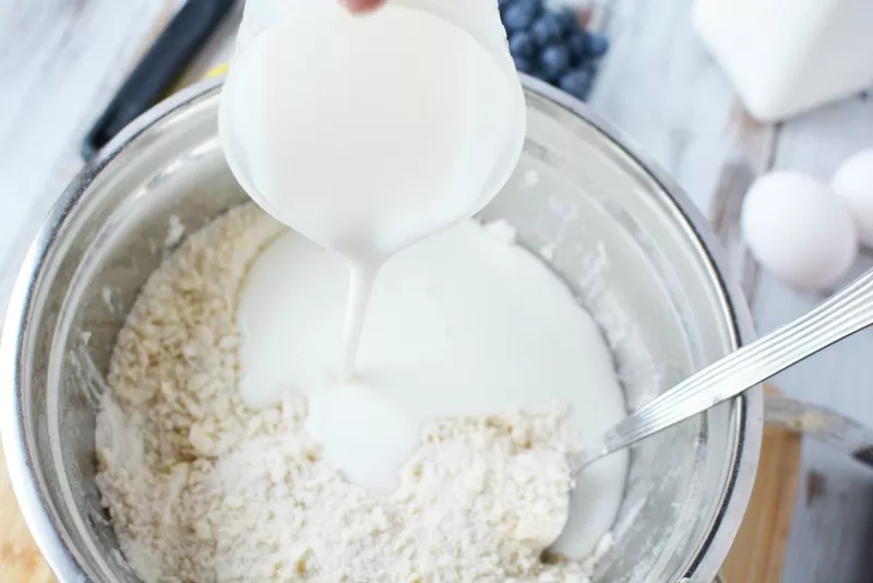 Adding wet ingredients for Blueberry Coffee Cake recipe