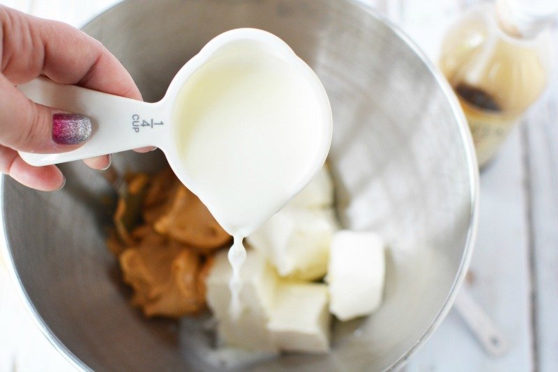 Adding ingredients for creamy peanut butter dip