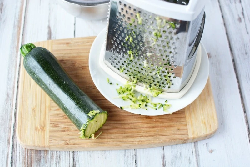 Grating zucchini for zucchini bread recipe