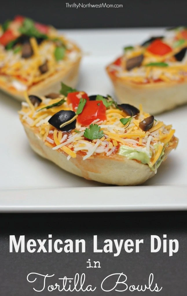 Mexican Layered Dip in Tortilla Bowls for Game Day Snack!