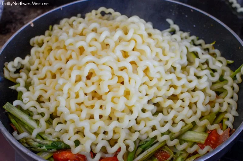 Bacon Asparagus and Tomato Pasta Cooking in Pan