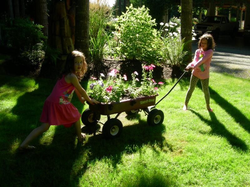 flower bed in a wagon reusing found items as planters ways kids can make money