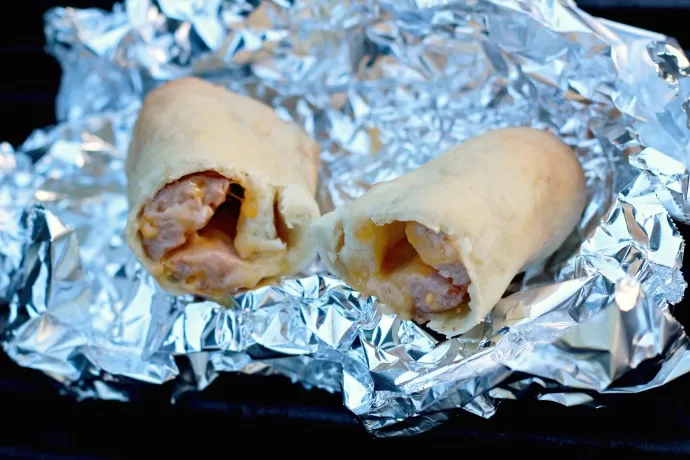 Cheese Sausage Rolls over the campfire