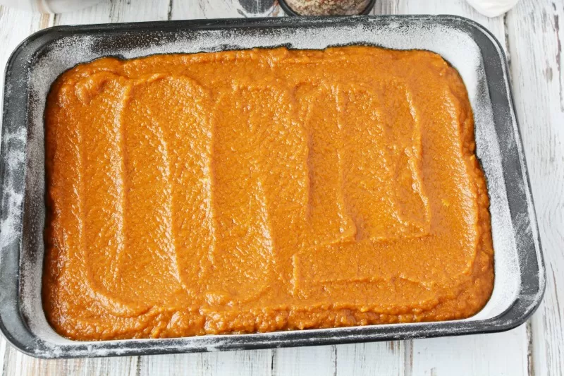 Spreading out Pumpkin Surprise to bake