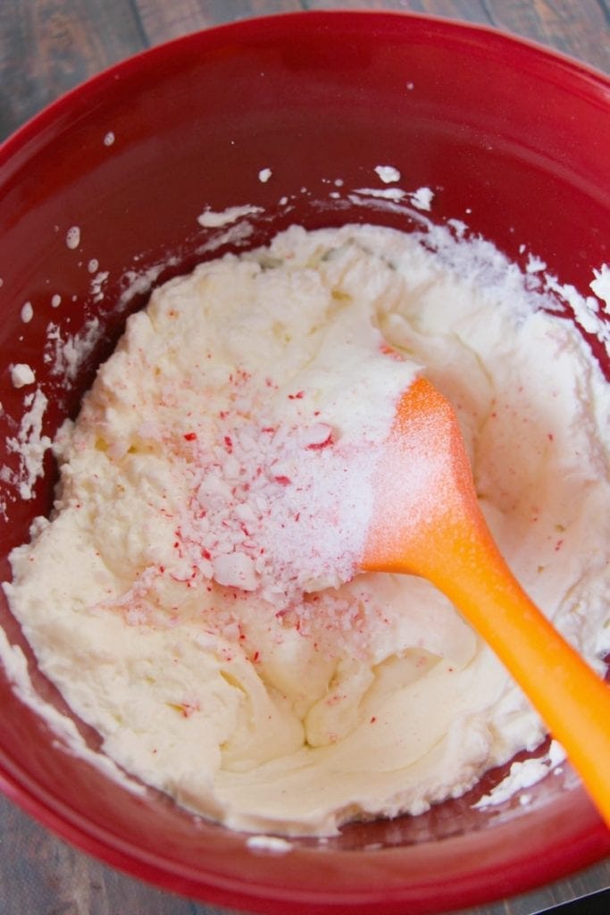 Mixing candy canes into peppermint ice cream