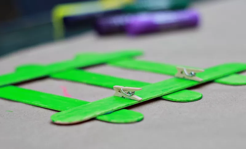 Adding mini clothespins to Fathers Day Frame