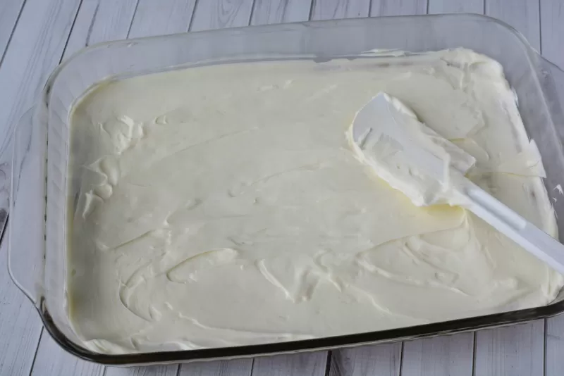 Spreading Cream Cheese for Lemon Cream Cheese Whip Dessert