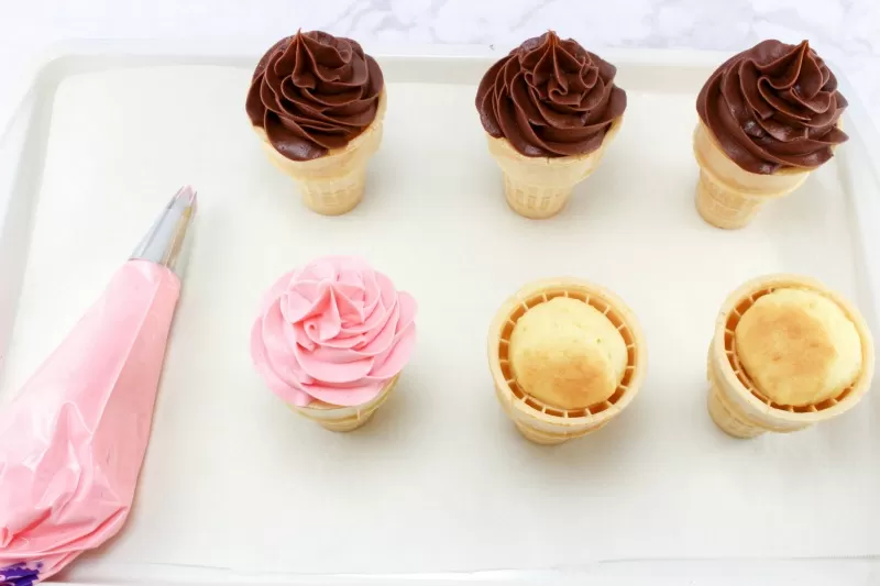 Adding frosting to Ice Cream Sundae Cupcakes