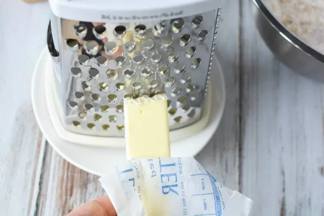 Grating butter for Blackberry Cobbler