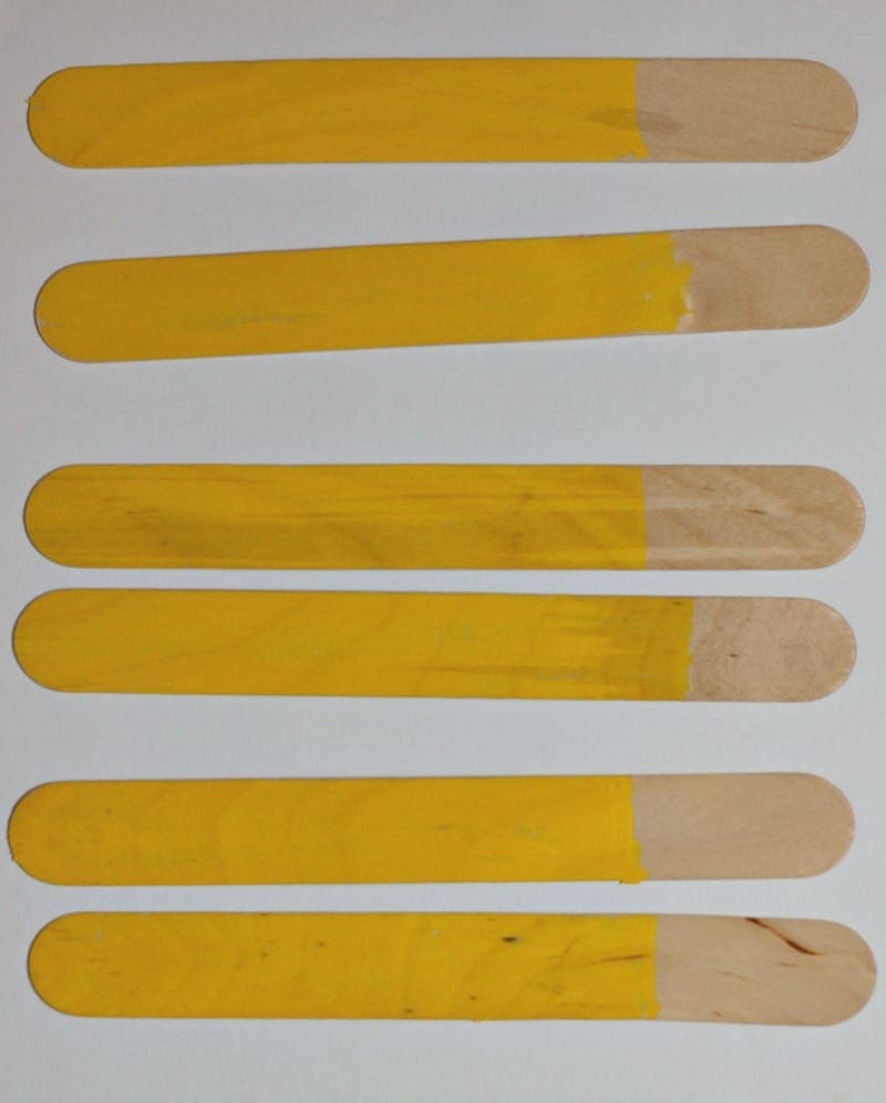 Popsicle sticks painted yellow
