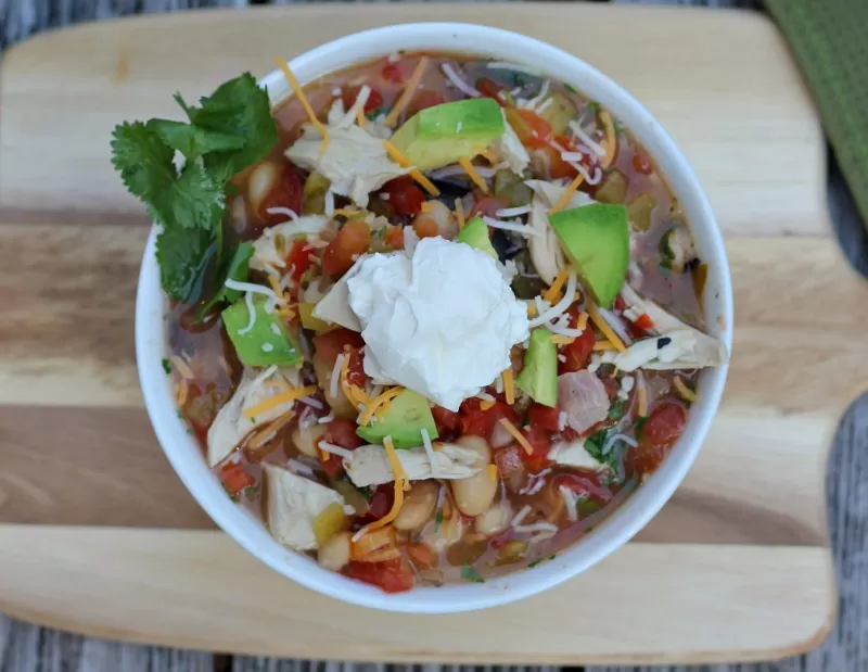 A healthy, lighter version of White Chicken Chili for the slow cooker is sure to be a hit!