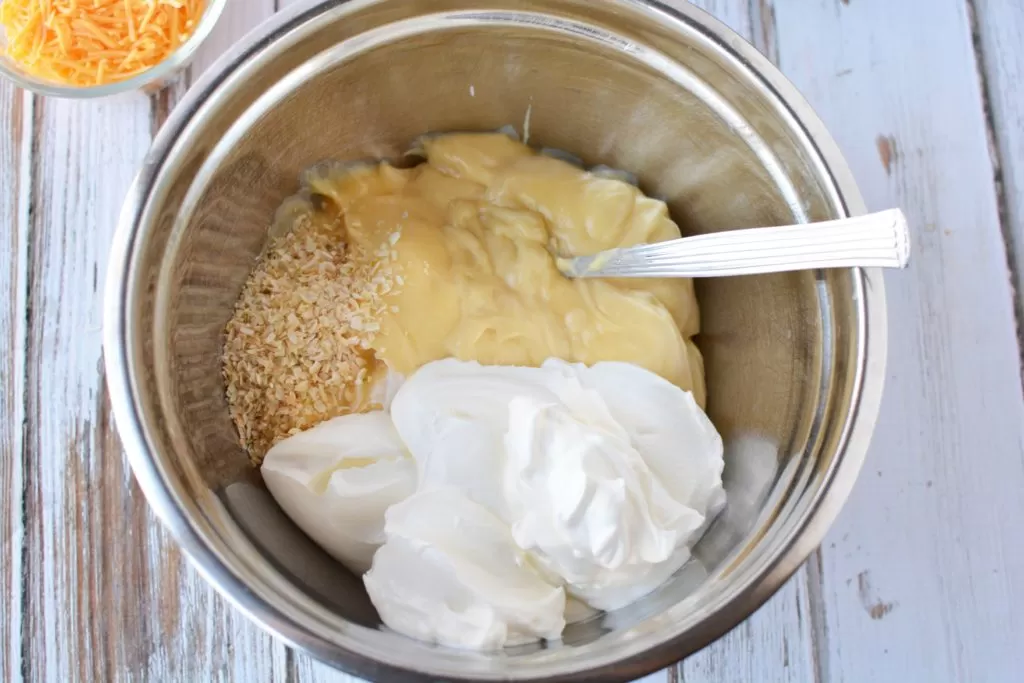 Ingredients mixed together for cheesy hashbrown potatoes