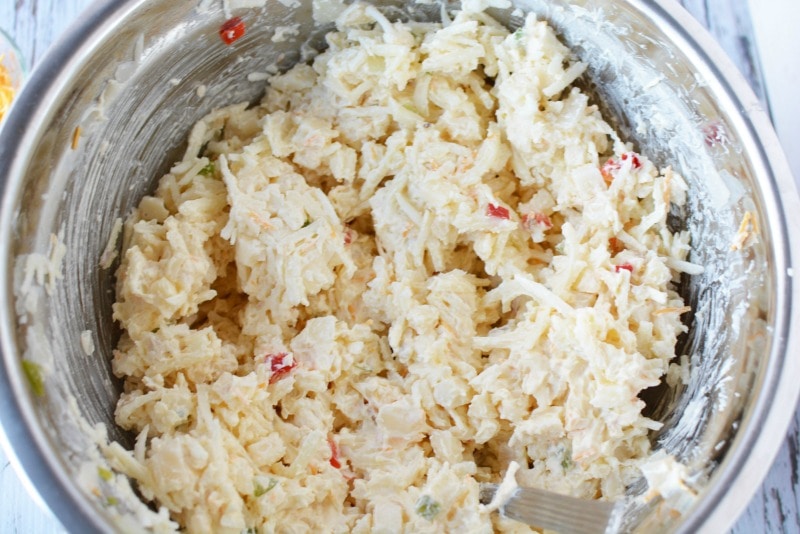 Mixing all ingredients together for Cheesy Hashbrown Potatoes