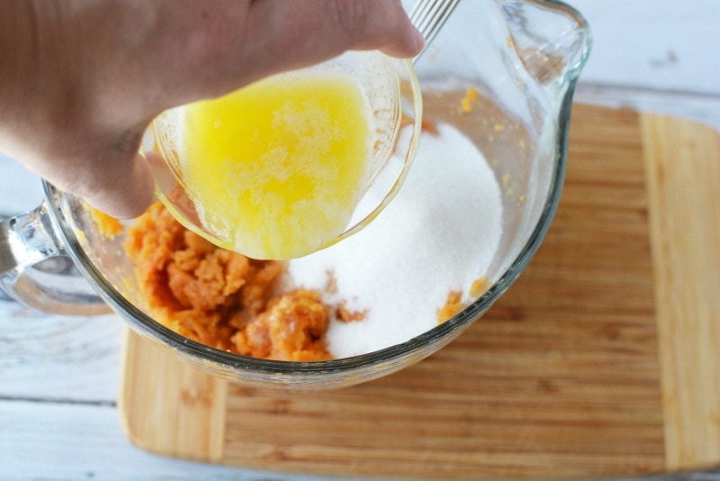 Mixing ingredients together for Sweet Potato Casserole