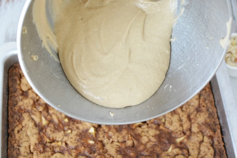 Adding frosting to Apple Cake