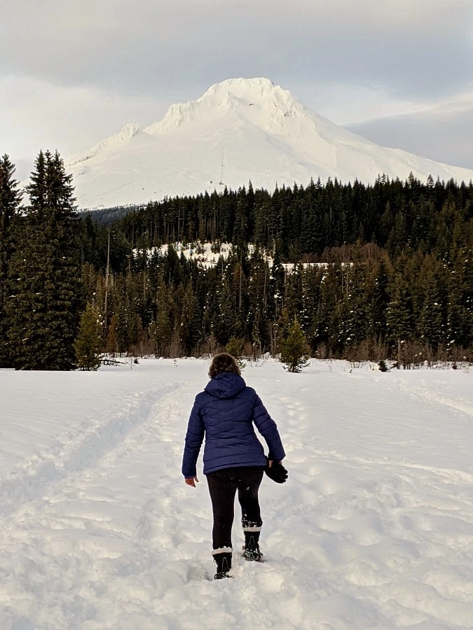 Snowshoeing at Trillium Lake with Mt Hood in distance