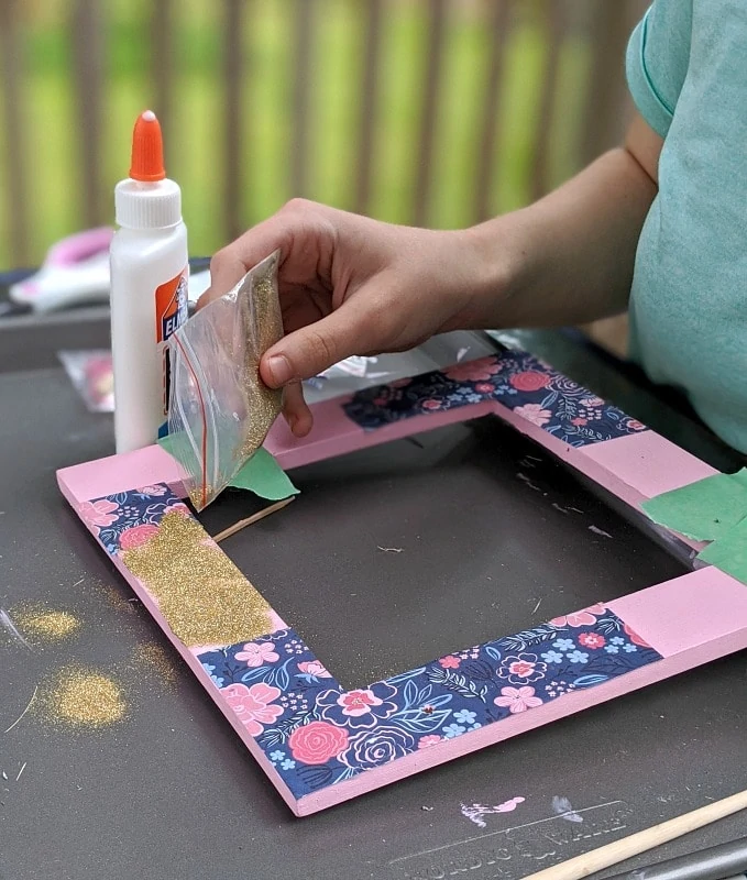 Putting glitter on Jewelry Organizer Craft