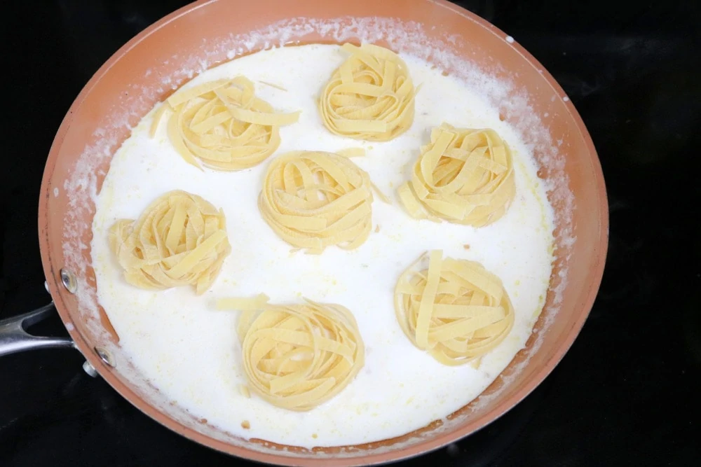 Cooking pasta for Chicken Alfredo Pasta