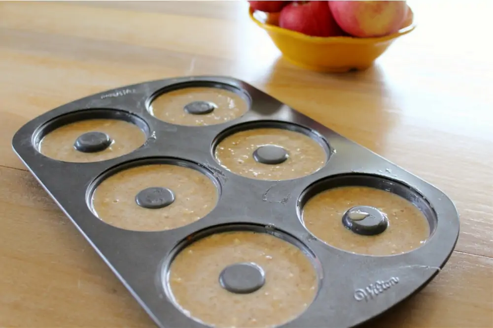 Pouring ingredients into donut pan