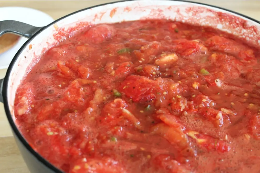 Cooking all ingredients together for spaghetti sauce