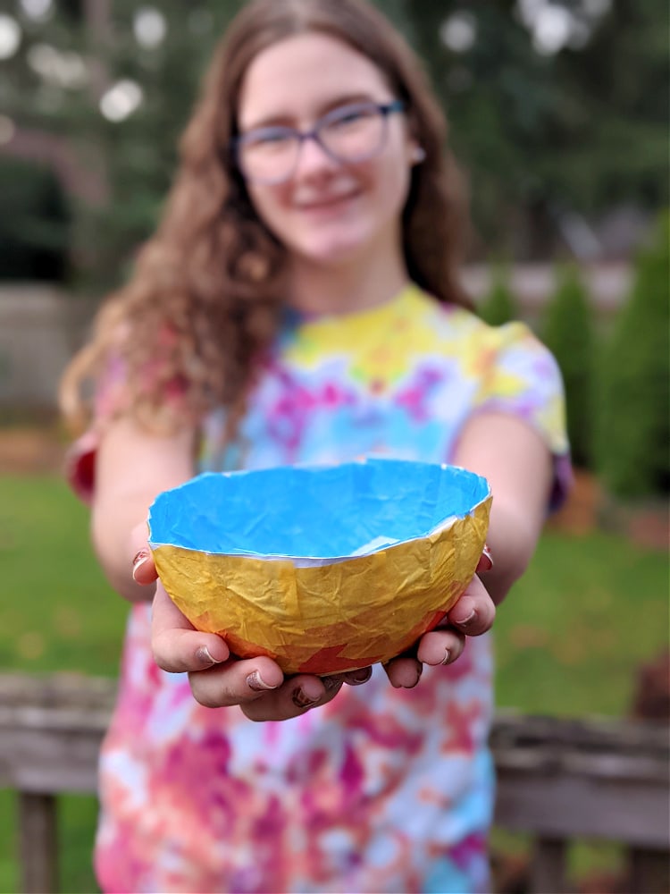 Holding the finished handcrafted bowl