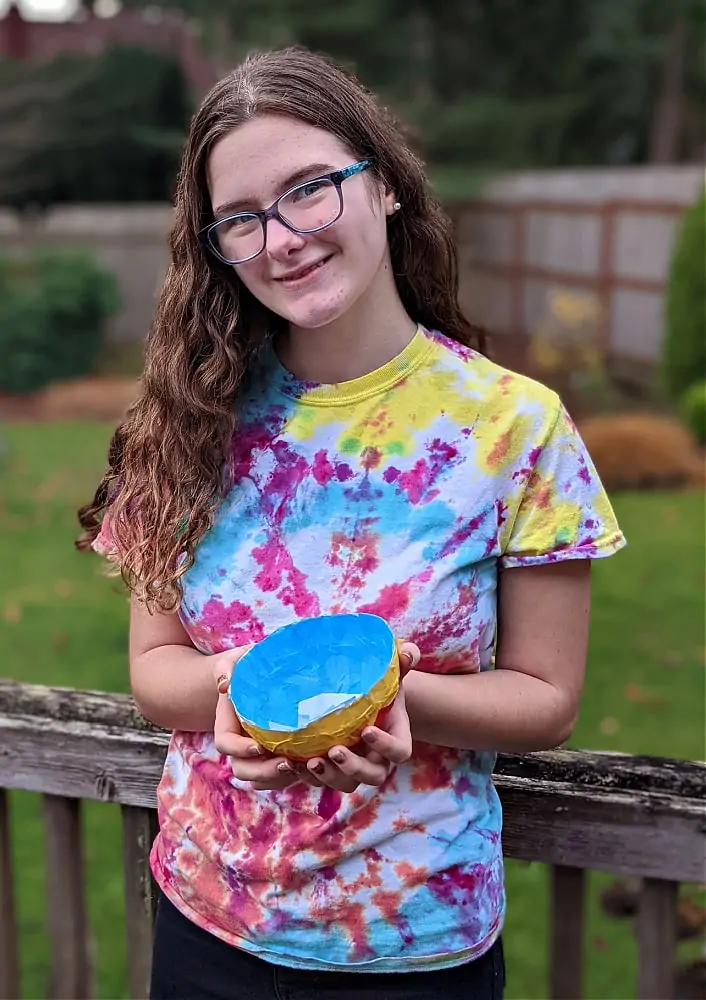 KiwiCo Handcrafted Bowl with girl outside