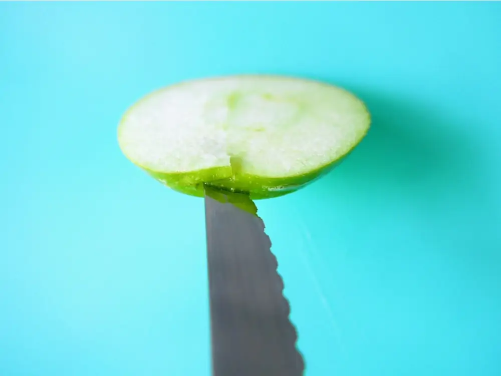 Slicing the apple for caramel apple pops