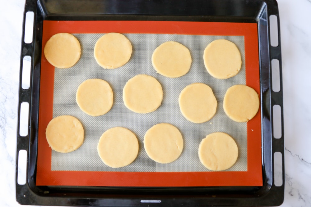 Cut dough into circles for Christmas light cookies