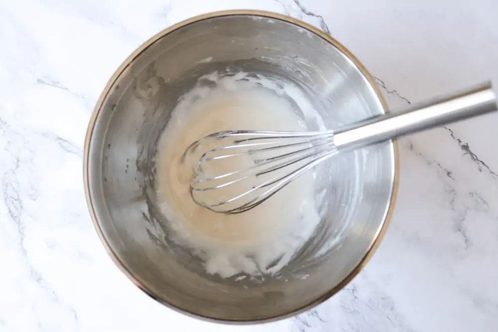 Mixing icing for Christmas light cookies