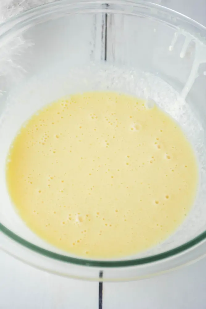 Mixing wet ingredients for eggnog donuts