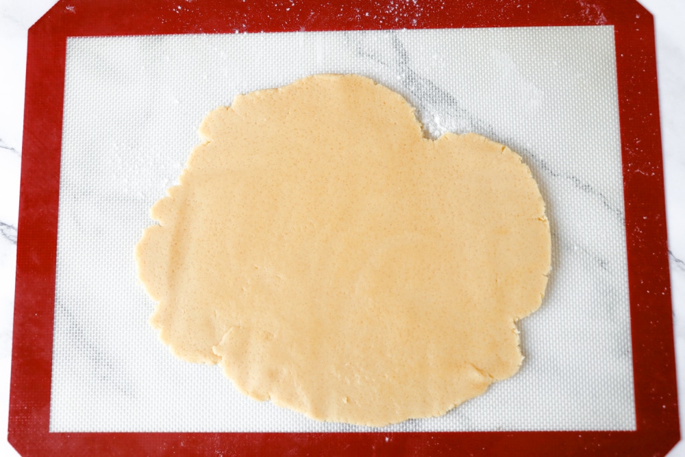 Rolling out dough for christmas light cookies