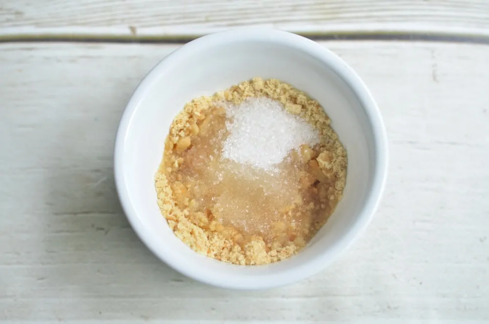 Adding sugar & butter to graham cracker crumbs for Key Lime Pie