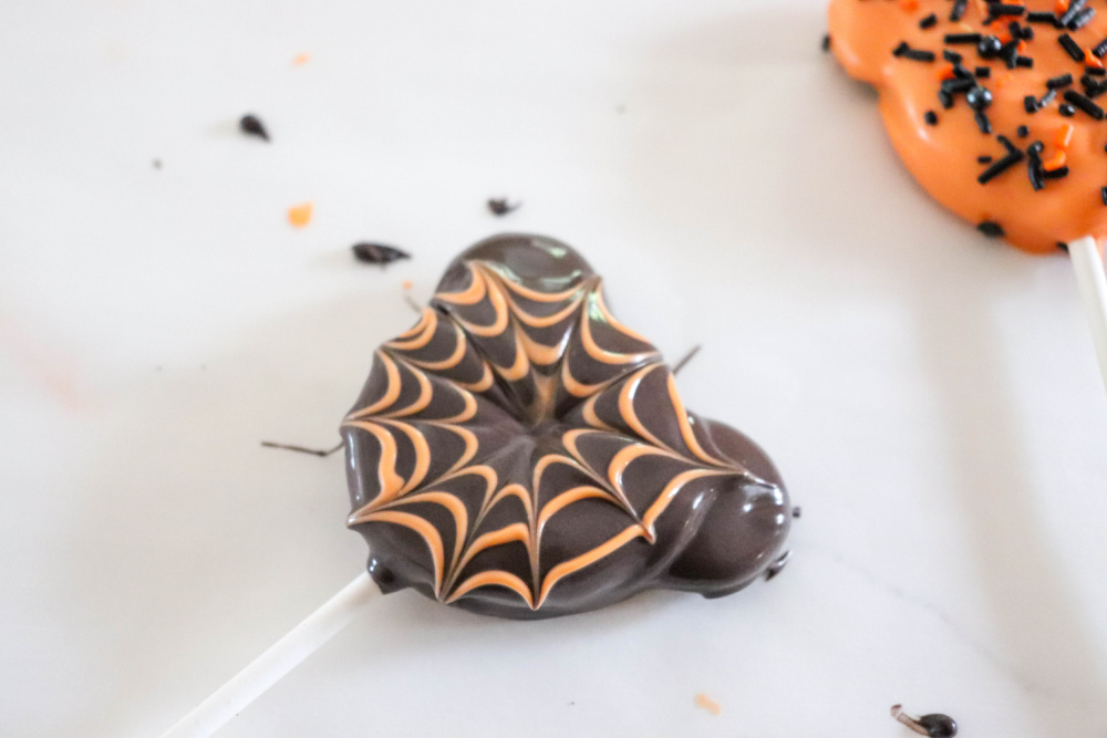 Making spider web for Oreo Halloween Pops