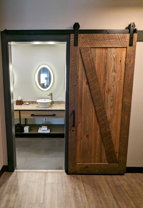 Barn doors in bathroom at Hotel Windrow