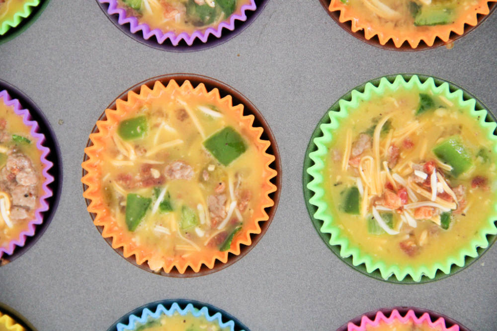 Close ups of egg cups ready to bake