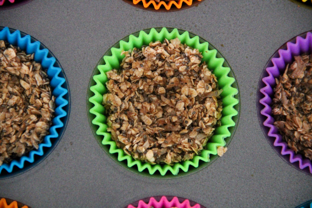 Closeup of granola mixture in muffin tin