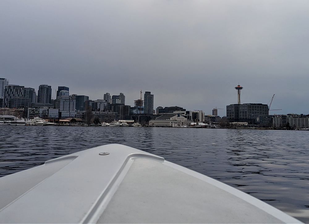 Electric Boat with view of Space Needle