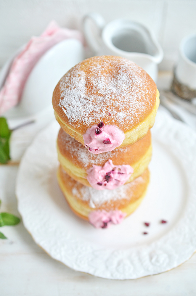 Raspberry Filled Donuts stacked on plate