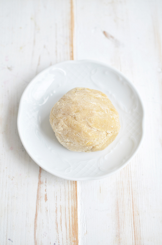 Making dough for raspberry filled donuts