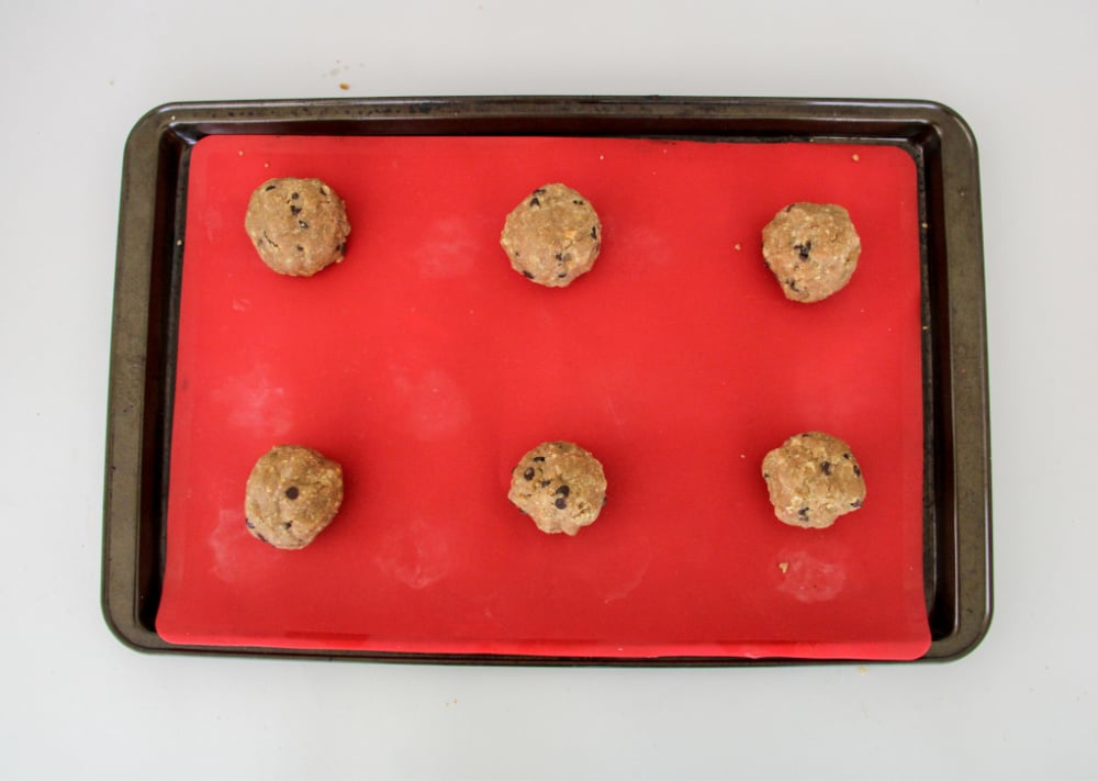 Placing graham cracker cookies on cookie sheet