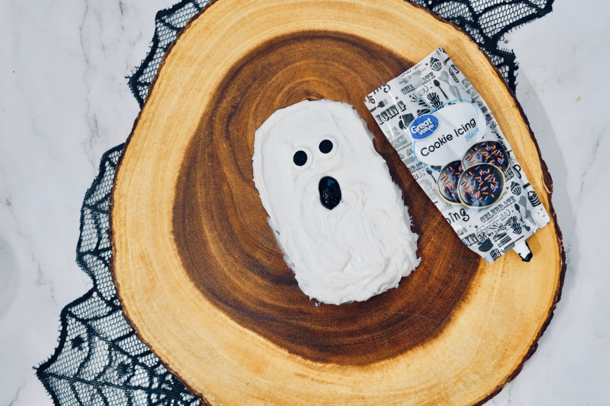 Adding mouth to ghost frosting board