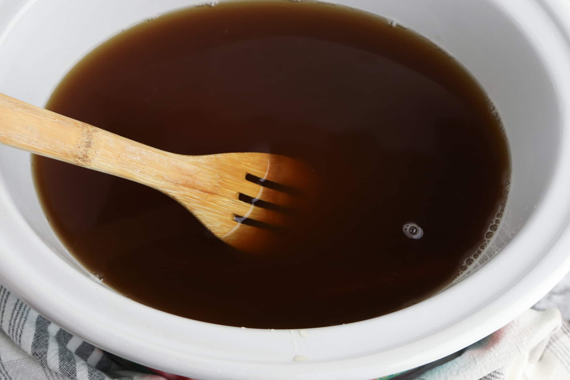 Mixing ingredients for crockpot apple cider